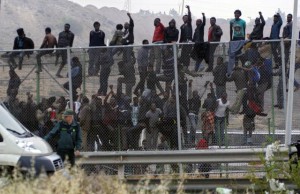 DOZENS OF SUBSAHARIAN IMMIGRANTS JUMP OVER INTO THE SPANISH LAND IN MELILLA