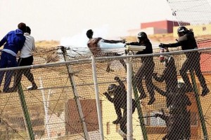 DOZENS OF SUBSAHARIAN IMMIGRANTS JUMP OVER INTO THE SPANISH LAND IN MELILLA
